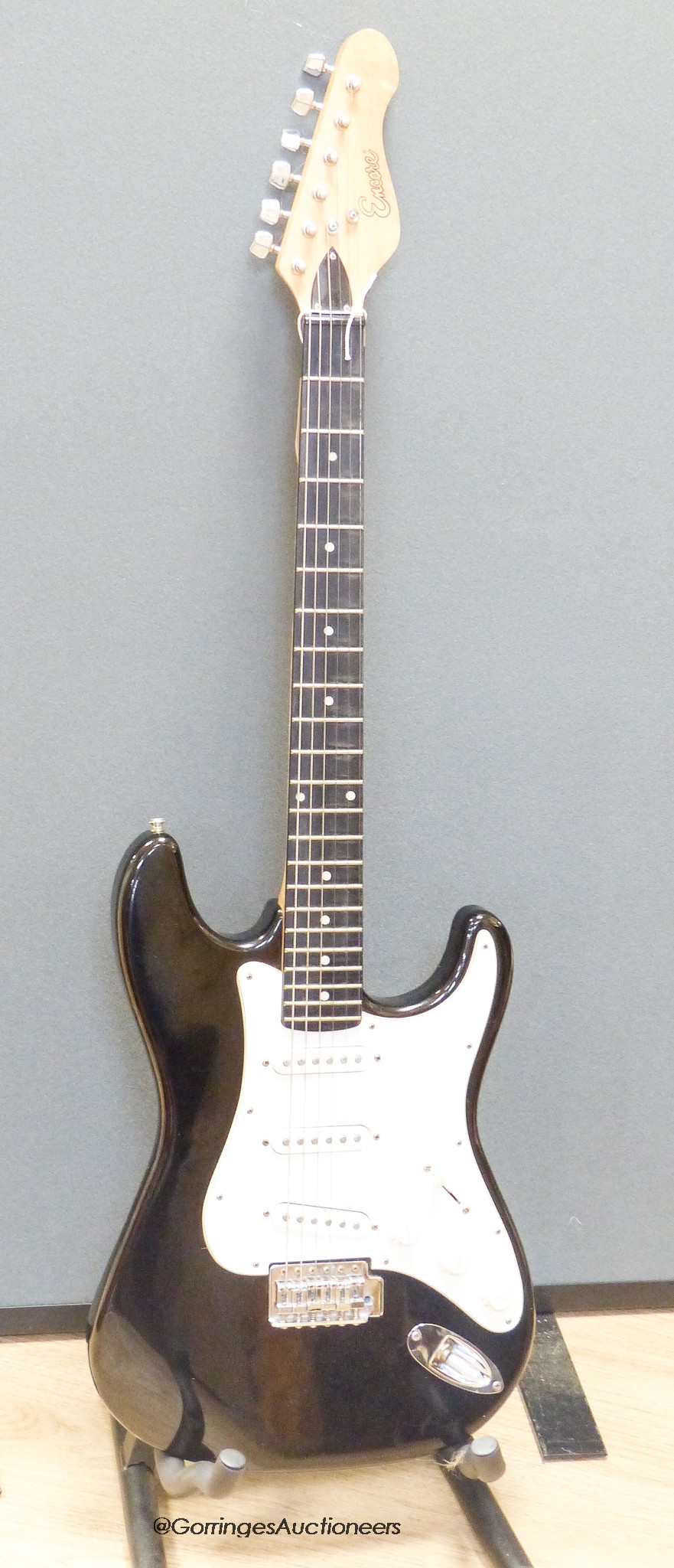 An Encore electric guitar with hard case